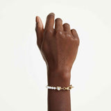 Pulsera Idyllia Perla de cristal, Blanca, Baño tono oro